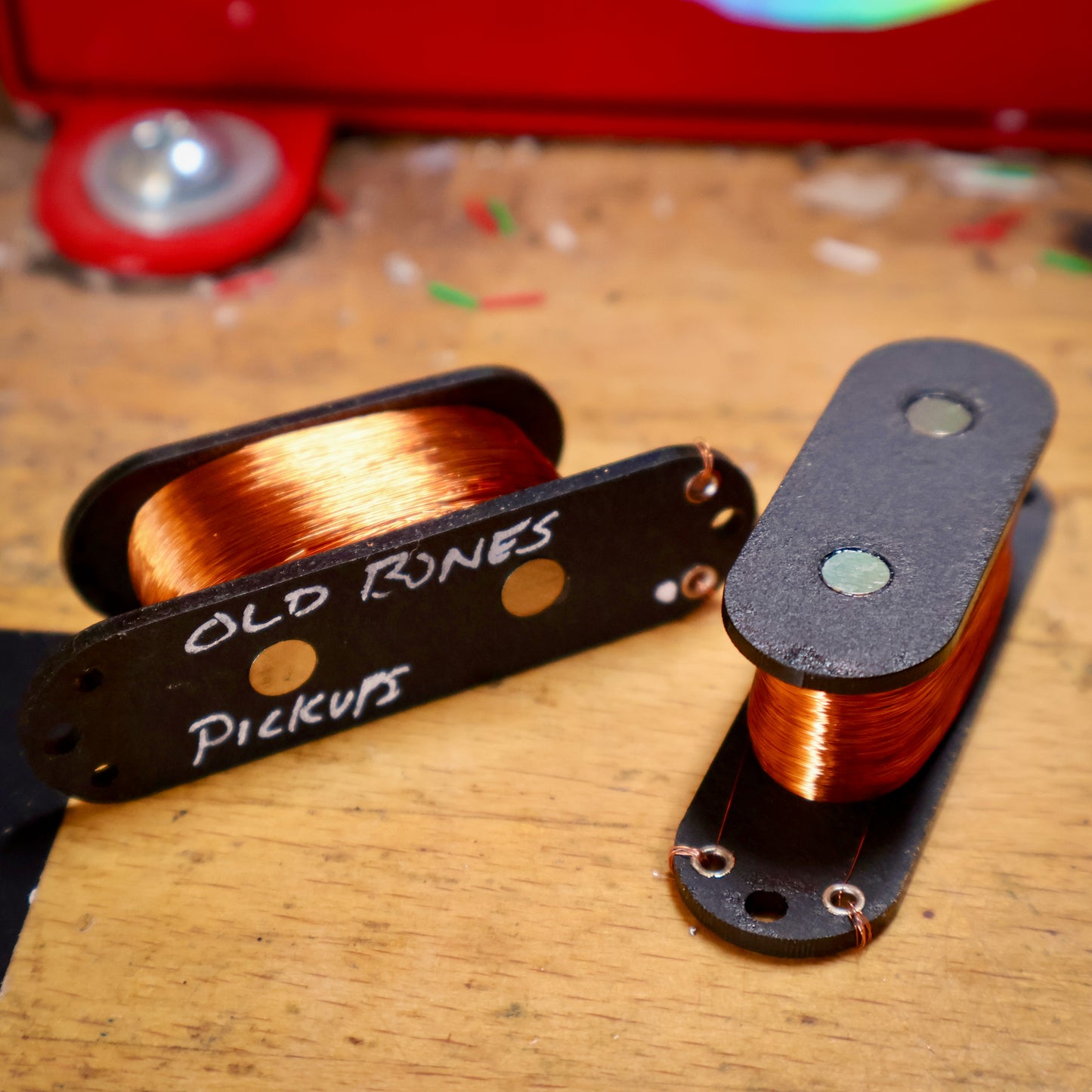 Mustang bass pickup coils in front of winding machine.